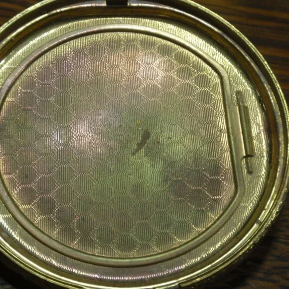 Gold Guild Compact with Sterling and Onyx Emblem.